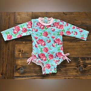 RUFFLE BUTTS one piece floral long sleeve swimsuit